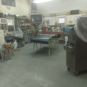Organized garage workspace with tools and workbenches - Larz from East Amherst, NY