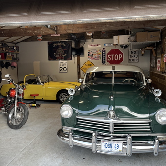 Classic Car Garage with Signs and Motorcycle - Dwight 
