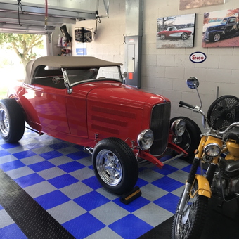 Classic Car and Motorcycle in Checkered Garage - Tom