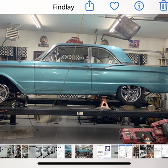 Classic car on four post lift with tools and decor - Hooter from Findlay, OH