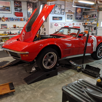 Classic Red Corvette on Ramps in Organized Garage - Robert from Douglasville, GA