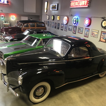 Classic Cars and Neon Garage Signs Displayed - Dave