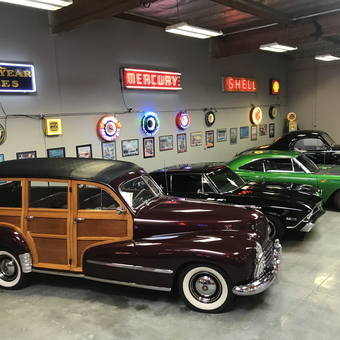 Classic Cars and Neon Garage Signs Displayed - Dave