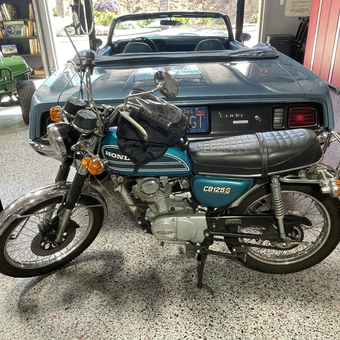 Classic motorcycle and vintage convertible in organized garage - Ron from Fallbrook, CA