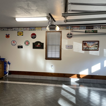 Garage with Vintage Signs and License Plates - Joanie