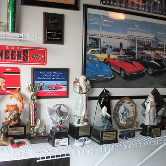 Garage Shelf With Trophies, Model Cars, and Wall Art - Scotty from St Petersburg, FL