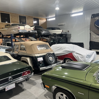 Classic cars with lifts and covers in organized garage - Brinkley from Greenville, NC