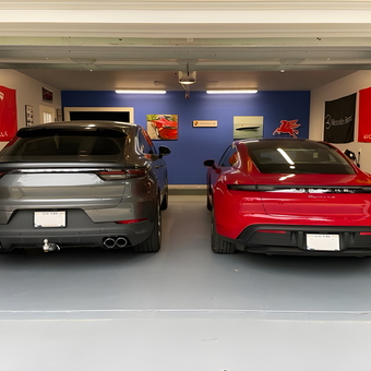 Organized garage with sports cars and wall banners - Vince from Peconic, NY