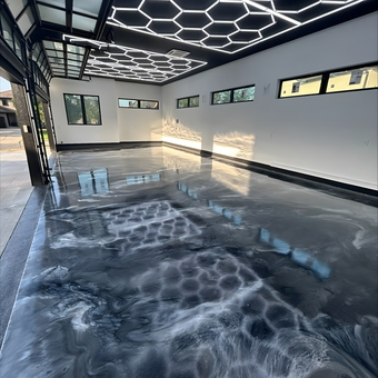 Modern garage with epoxy floor and LED hex lights - Kevin