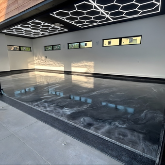 Modern garage with epoxy floor and LED hex lighting - Kevin