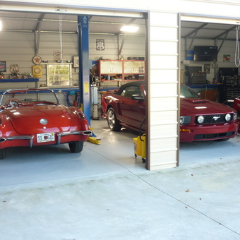 Classic and Modern Red Cars in Organized Garage - Dino from Cocoa, FL