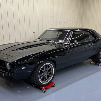 Classic Black Muscle Car on Wheel Dollies - Scott