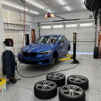 Home Garage With Car Lift, Hose Reel, and BMW Wheels - JK84 from Plainfield, IL