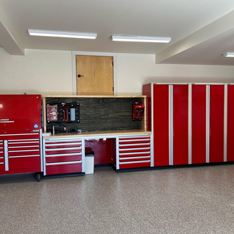 Red Tool Cabinets and Workbench in Organized Garage - Geir