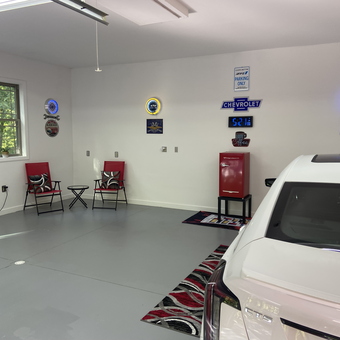 Organized garage with neon signs, chairs, and mini fridge - Oldman from Huntingdon, PA