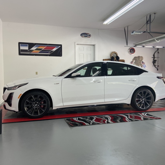 Modern garage with white sports car and red tool cabinet - Oldman from Huntingdon, PA