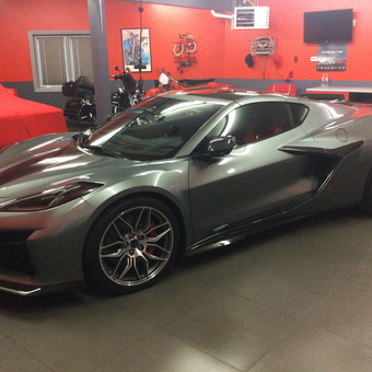 Modern garage with Corvette, motorcycles, and wall decor - Tbob from Rapid City, SD