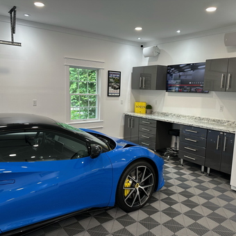 Modern garage with cabinets, flooring, and blue sports car - Tom from LA, CA