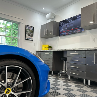 Modern garage with gray cabinets and blue Lotus - Tom from LA, CA