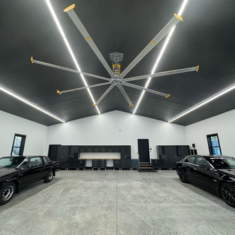 Modern garage with black cabinets, LED lights, and cars - Art