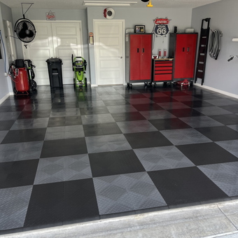 Organized garage with red cabinets and tile flooring - JP from The Villages, FL