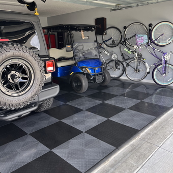 Garage with Checkered Tile Flooring and Wall Bike Storage - JP from The Villages, FL