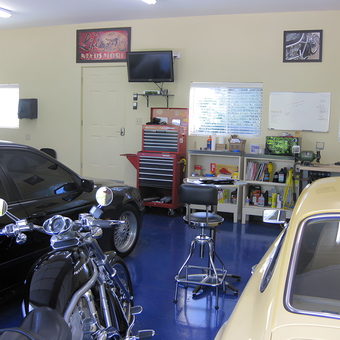 Organized garage with tool chest, workbench, cars, and motorcycles - Sam from Louisville, KY