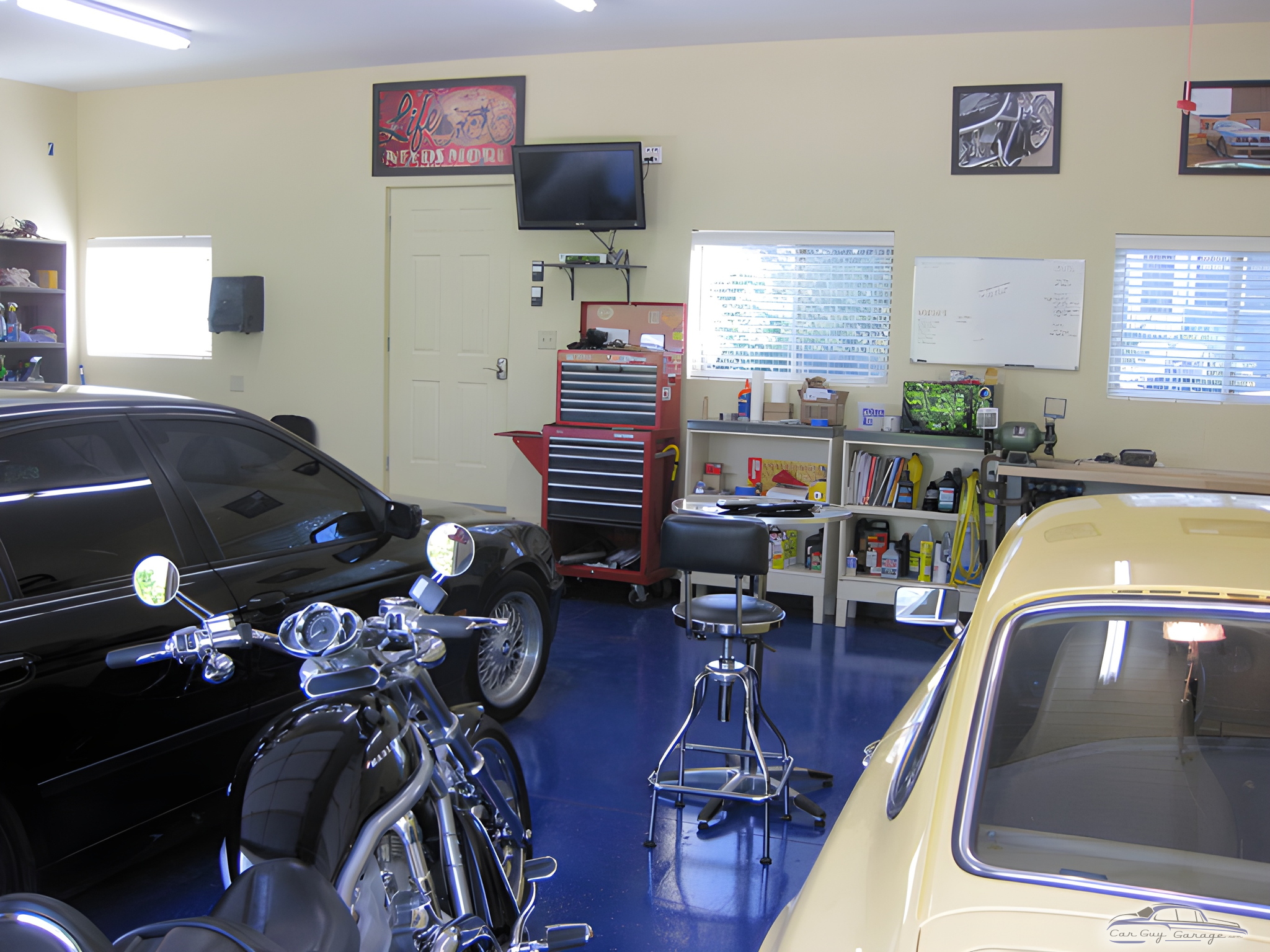 Organized garage with tool chest, workbench, cars, and motorcycles - Sam from Louisville, KY