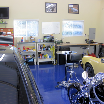 Organized garage with tool chest, workbench, and cars - Sam from Louisville, KY