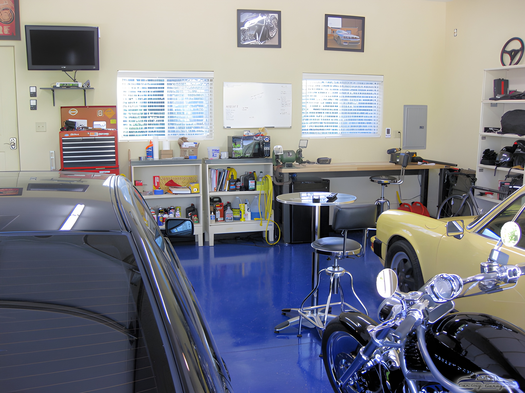 Organized garage with tool chest, workbench, and cars - Sam from Louisville, KY