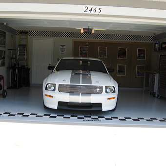 Organized garage with white Mustang and storage cabinets - Loy from Kissimmee, FL