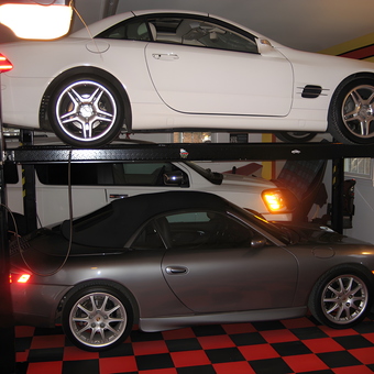 Four post car lift with sports cars and checkered floor - George from Locust Grove, VA