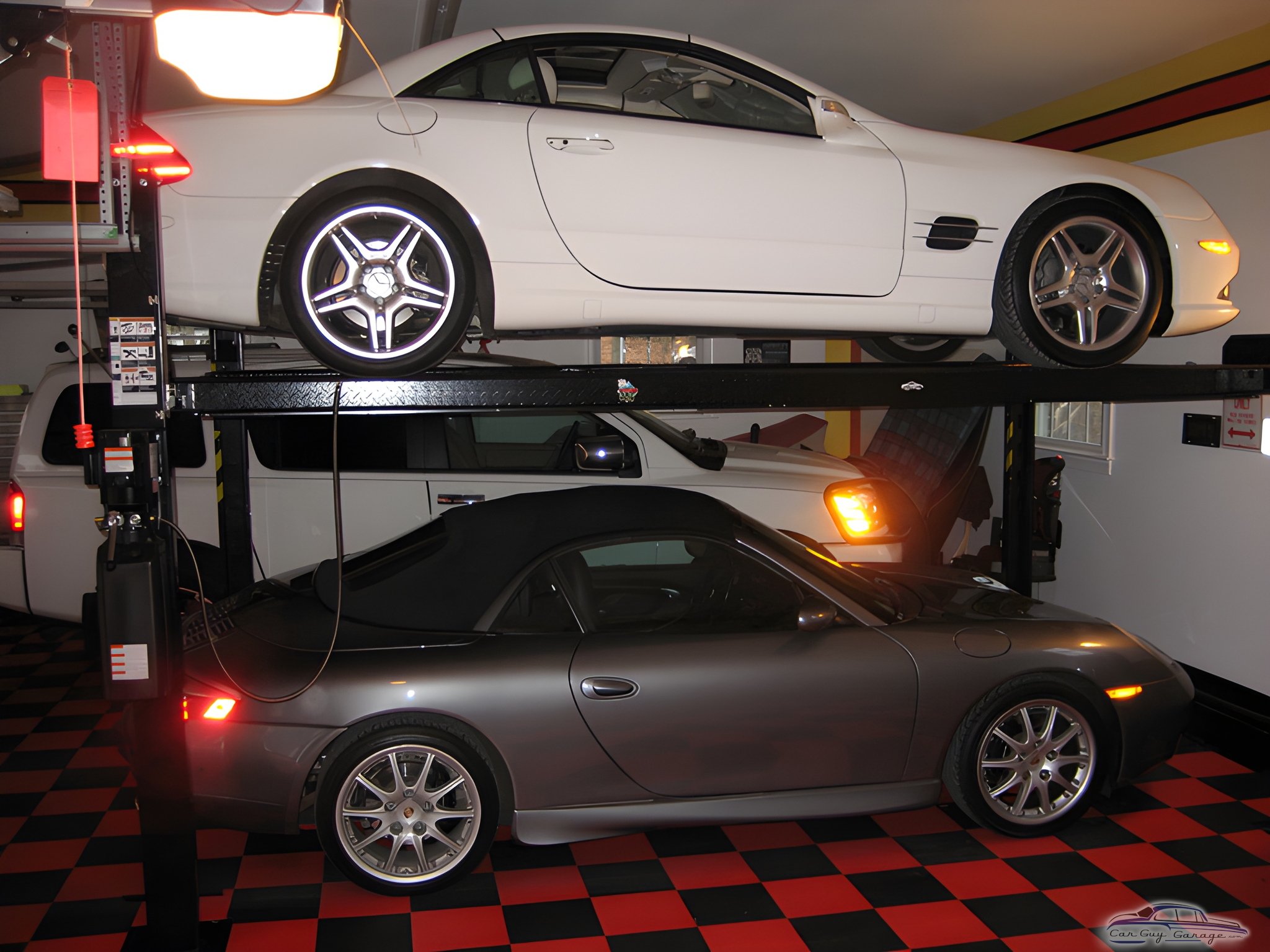 Four post car lift with sports cars and checkered floor - George from Locust Grove, VA