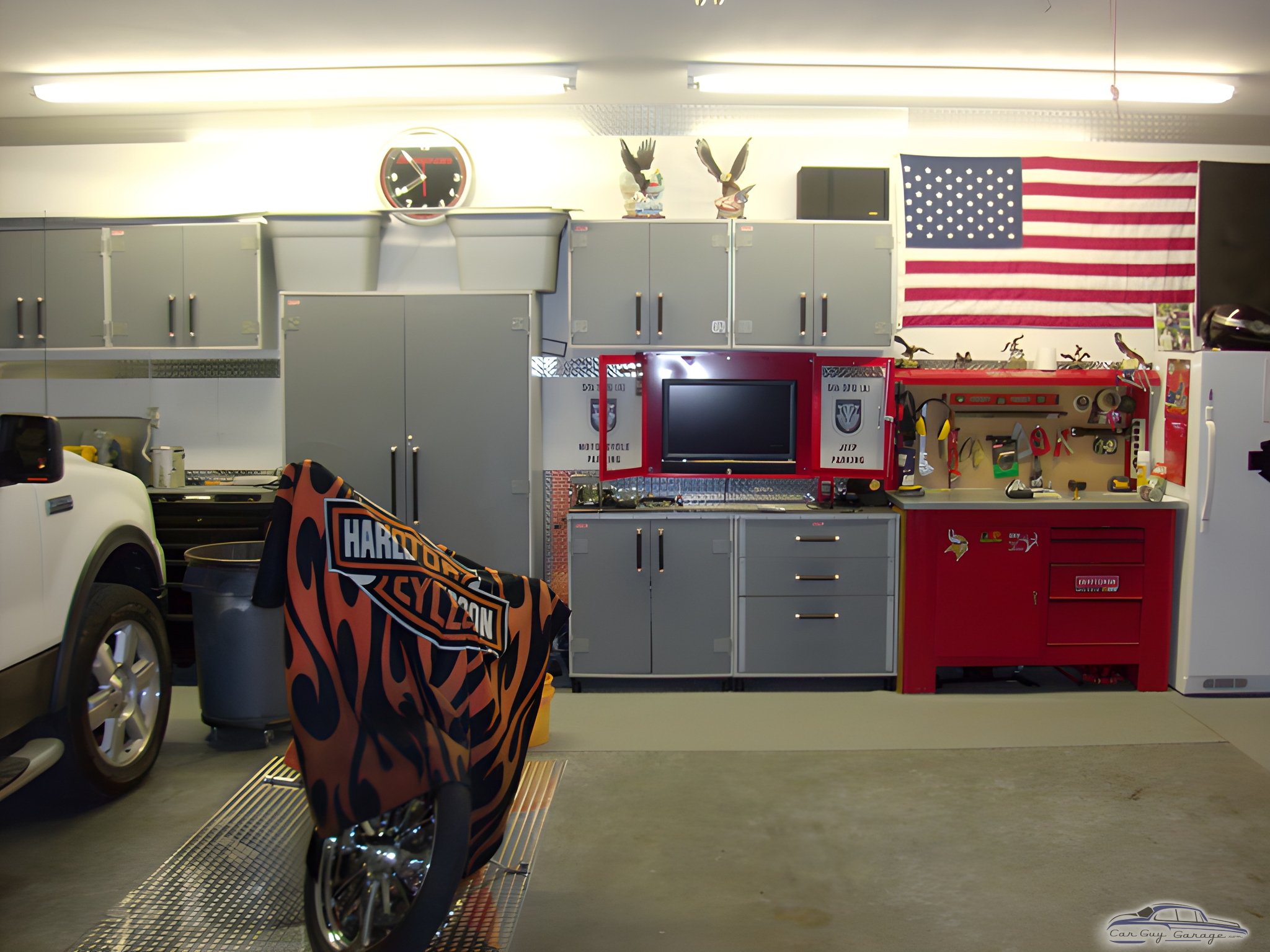 Organized garage with cabinets, workbench, and motorcycle - Jeremy from Clarksville, TN