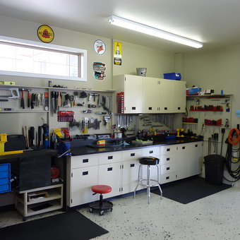 Organized garage workspace with cabinets and pegboard tools - Glen from Chicago, IL
