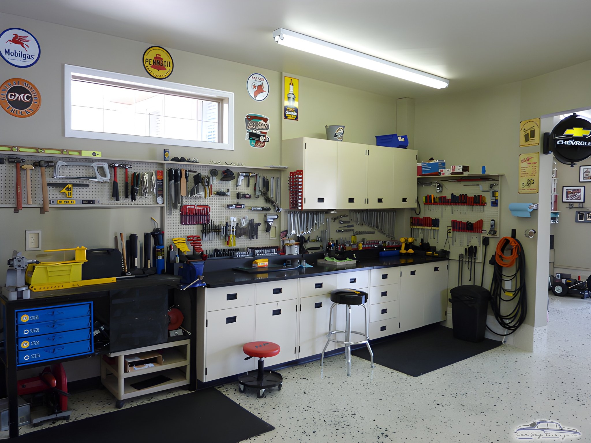 Organized garage workspace with cabinets and pegboard tools - Glen from Chicago, IL