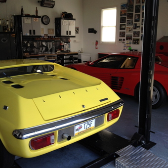 Organized garage with car lift, tool cabinets, and classic cars - Cragar from Ivyland, PA