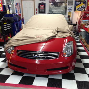 Organized garage with Infiniti G35, tool chests, and decor - Mark from Fishers, IN