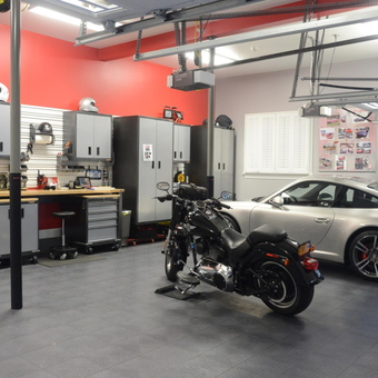 Organized garage with cabinets, workbench, car and motorcycle - RockSteady from Melville, NY