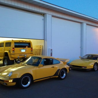 Yellow Hummer and Classic Sports Cars in Garage - Dan from Maple Grove, MN