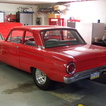 Organized garage with red classic car and storage cabinets - Ken from Derry, PA