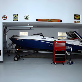 Organized garage with boat, red tool chest, and wall decor - David from Tallahassee, FL
