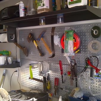 Organized pegboard tool storage with shelves - John from Brielle, NJ