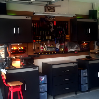 Organized garage with black cabinets and tool storage - Ernie from Davenport, FL