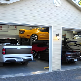 Spacious garage with car lifts and vehicles - Daniel from Quebec, Canada