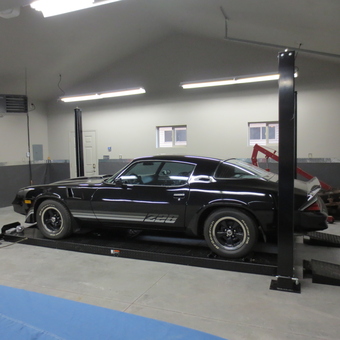 Classic car on four post lift in organized garage - Randy from Green Bay, WI