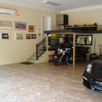 Organized garage with tile floor, loft, and vehicles - Len from Sewalls Point, FL