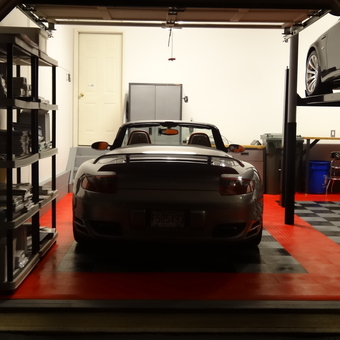 Organized garage with car lift and storage shelves - Philip Alfano from Monroe Township, NJ