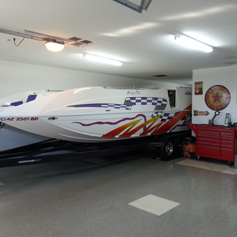 Custom boat in garage with red tool chest and wall signs - Chuck from Riverside, CA