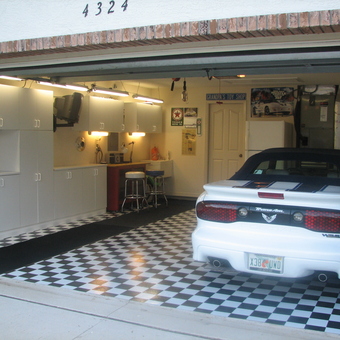 Garage with Checkered Flooring, Cabinets, and Trans Am - Kip from Beverly Hills, FL